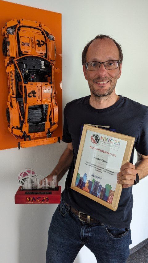 Marko Thiele with his award and certificate for Best Presentation at the NAFEMS World Congress 2023.